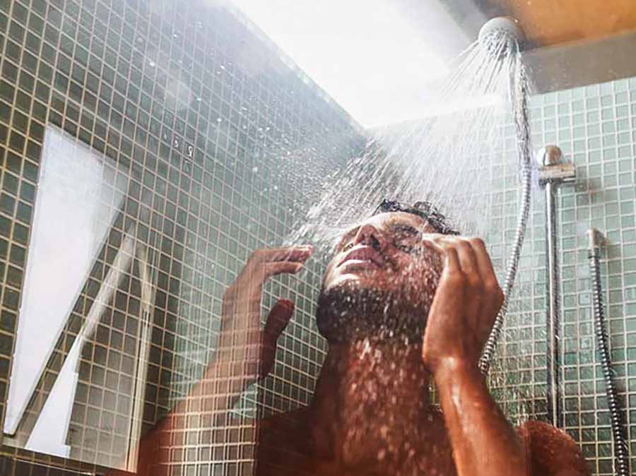 A man showering after rhinoplasty