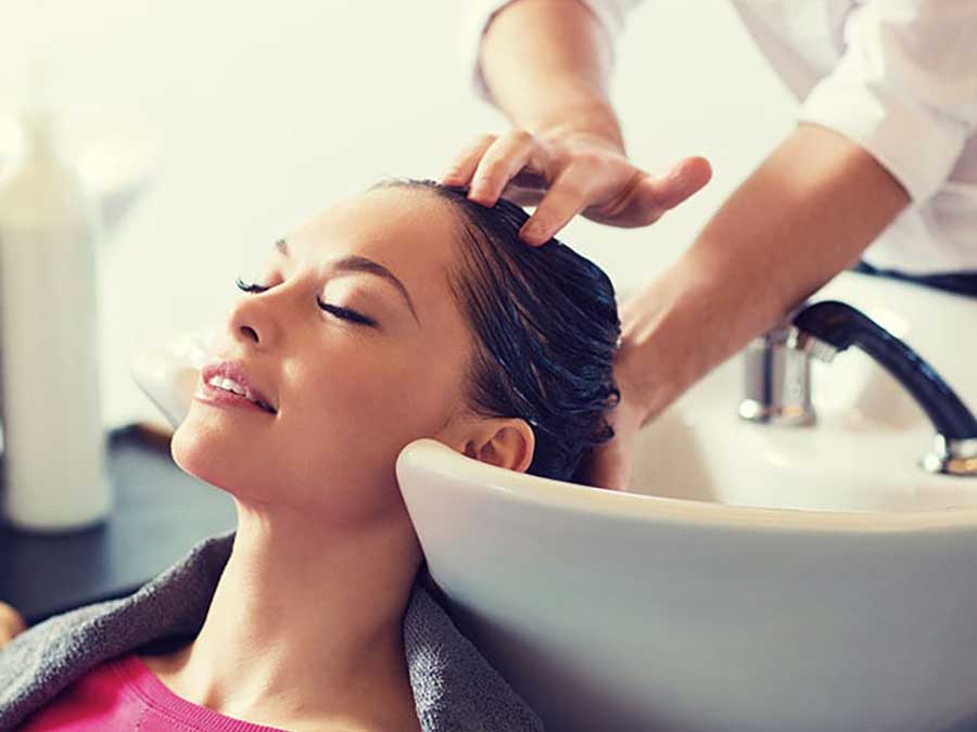 A woman having her hair washed